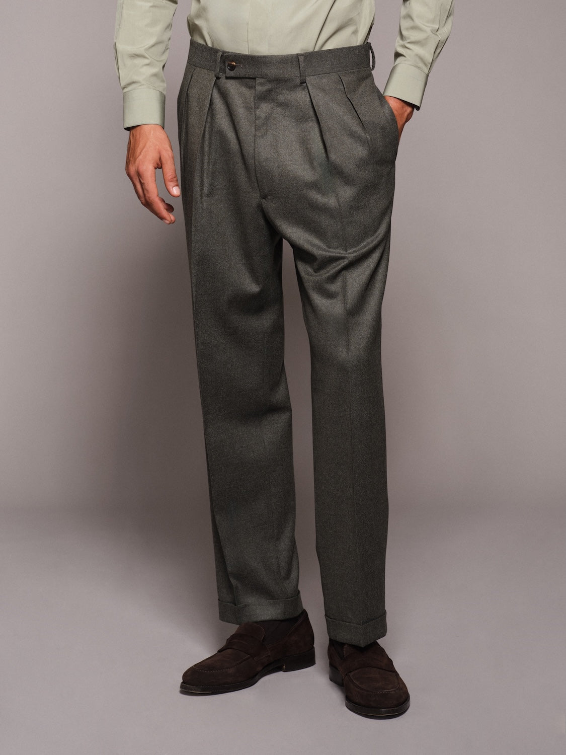 High-waisted trousers in green wool flannel