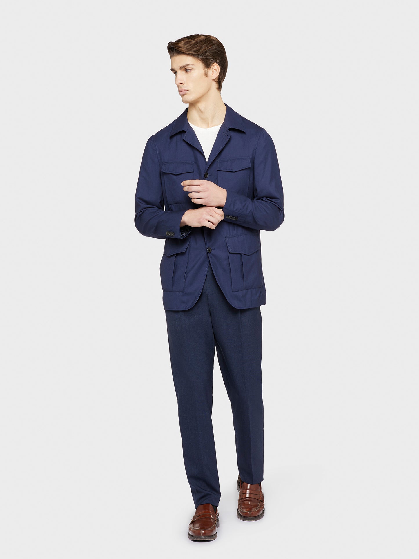 Caruso Menswear Abbigliamento Uomo Giacca Sahariana sfoderata estiva con quattro tasche a toppa di lana seta blu Nuage drop 8R total look